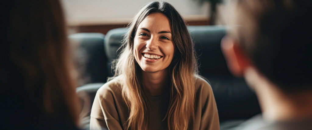 Woman smiles and listens